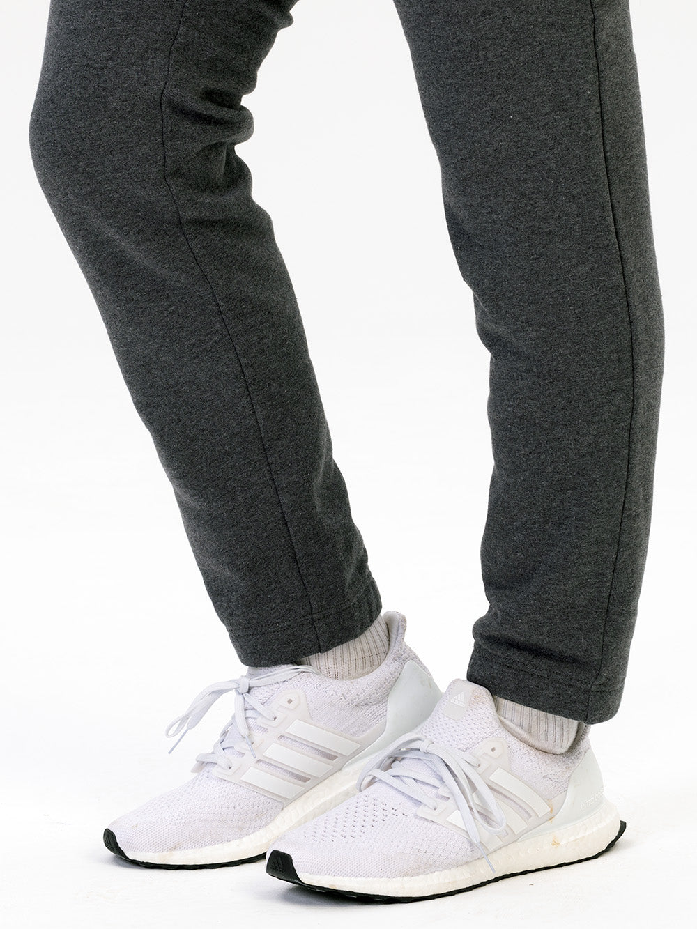 dark grey joggers and trainers