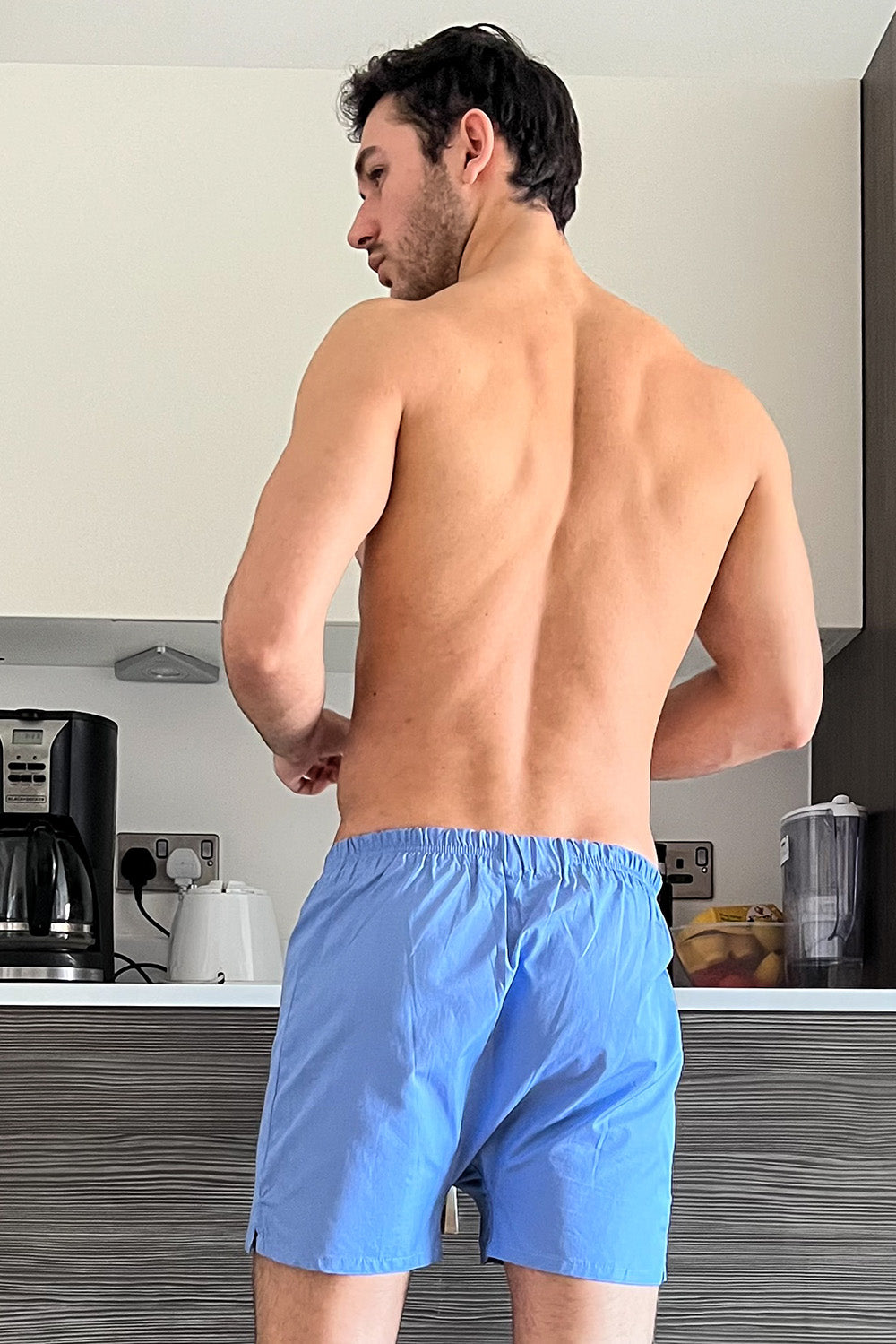 man wearing blue cotton boxer shorts